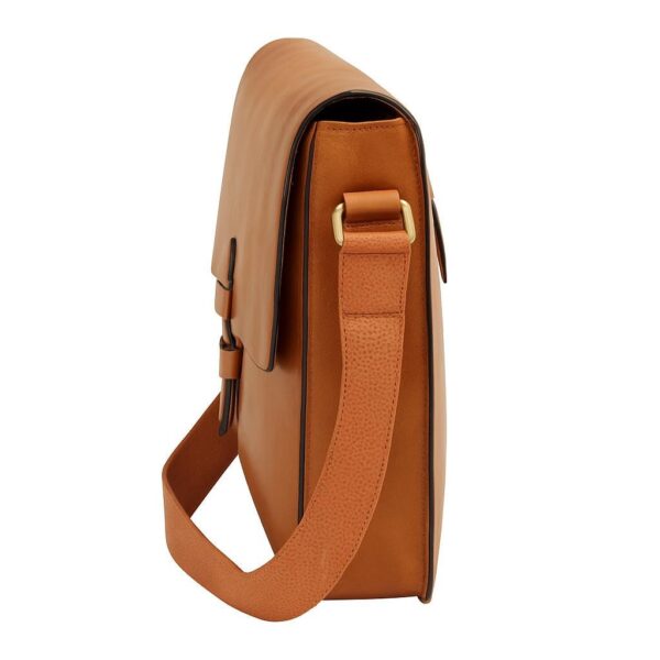 Side view of a tan leather messenger bag with a structured rectangular shape, showing the attachment of a wide, textured canvas shoulder strap and a brass-tone rectangular loop.