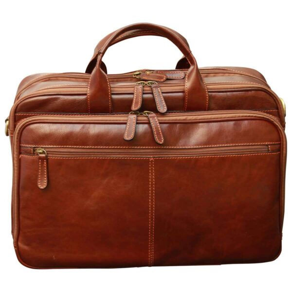 Front view of a reddish-brown leather briefcase with double top handles, featuring multiple zippered sections and a large horizontal zippered pocket on the front.