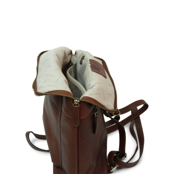 Brown leather backpack with zipper, open interior view showing compartments and lining