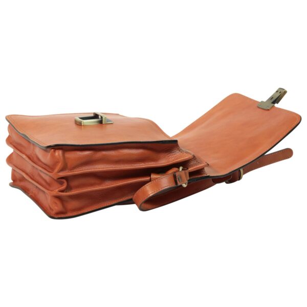`Tan genuine leather briefcase shown open with flap folded back revealing multiple compartments and antique gold turn-lock closure, top-down angle view`