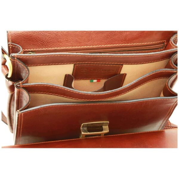 `Old Angler tan genuine leather bag interior showing beige lining, multiple compartments, zip pocket, Italian flag label and antique gold buckle closure, detail interior shot`