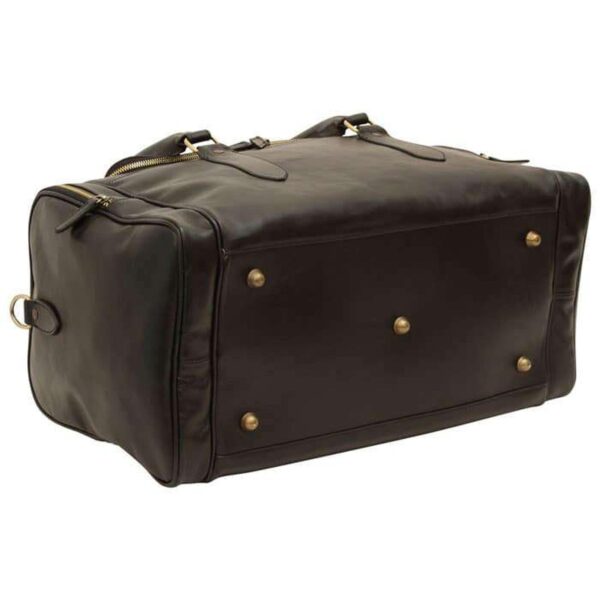 The bottom and side view of a large black leather duffel bag, featuring five brass protective feet on the base and gold-toned zipper hardware.