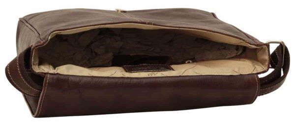 An open dark brown leather messenger bag showing the interior tan fabric lining filled with crumpled packing paper.