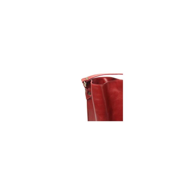 A close-up studio shot of a red leather bag's upper edge and strap attachment, featuring metallic rivets and a textured finish against a white background.
