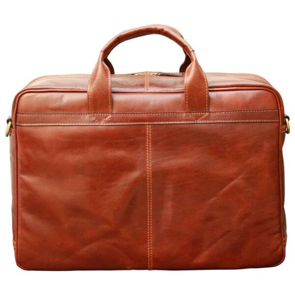 A front view of a closed reddish-brown leather briefcase with a polished finish, featuring sturdy rolled top handles, decorative vertical stitching, and a structured rectangular design against a white background.