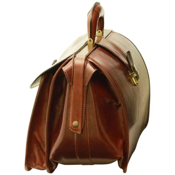 A vintage-style brown leather doctor's bag with a hinged top frame, a sturdy handle, and a side pocket, isolated on a white background.