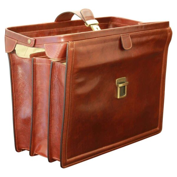 A three-quarter view of an open, cognac-colored leather doctor-style briefcase, showing the multi-compartment gusseted design and the brass-tone lock hardware on the front flap.