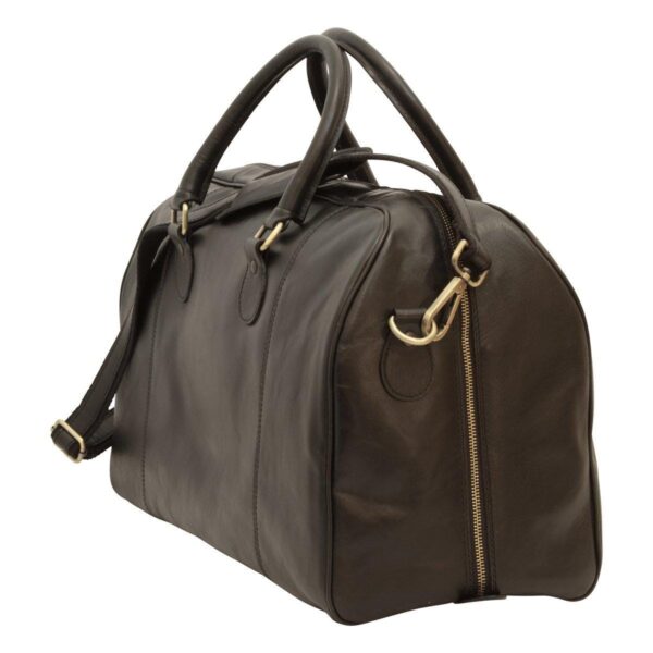 A side-angle view of a dark brown leather duffel bag, highlighting a vertical side zipper, brass-tone hardware, and rounded leather carry handles.