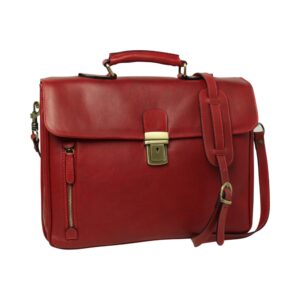 A red leather briefcase with a top handle, an adjustable shoulder strap, and a brass tuck-lock clasp, featuring a small vertical zippered pocket on the front left.