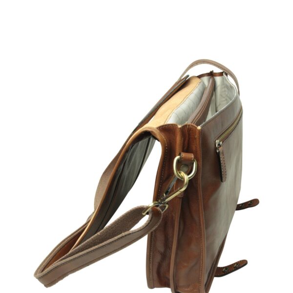 A high-angle side view of a brown leather messenger bag with the main flap open. The shot reveals the bag’s multi-layered interior, including a zippered middle divider, a light-colored fabric lining, and a rear zippered pocket on the exterior.