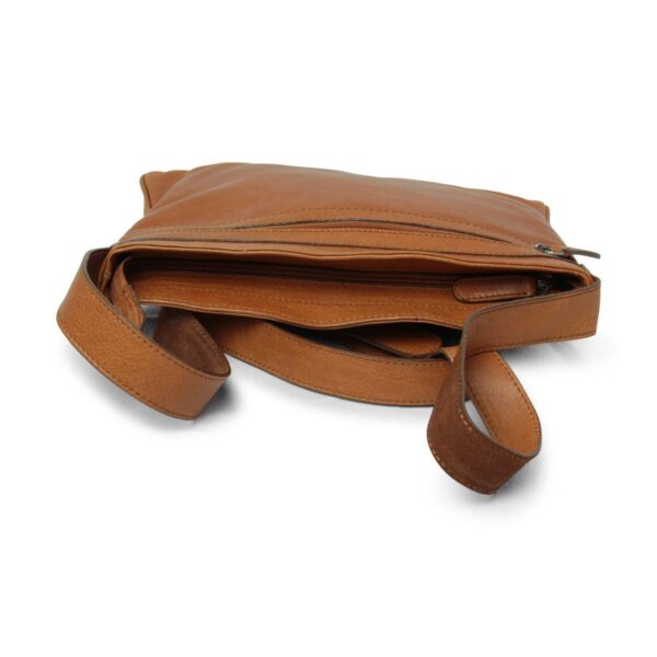 A three-quarter view of an open tan leather crossbody bag lying flat, featuring multiple zippered compartments and a matching adjustable leather shoulder strap.