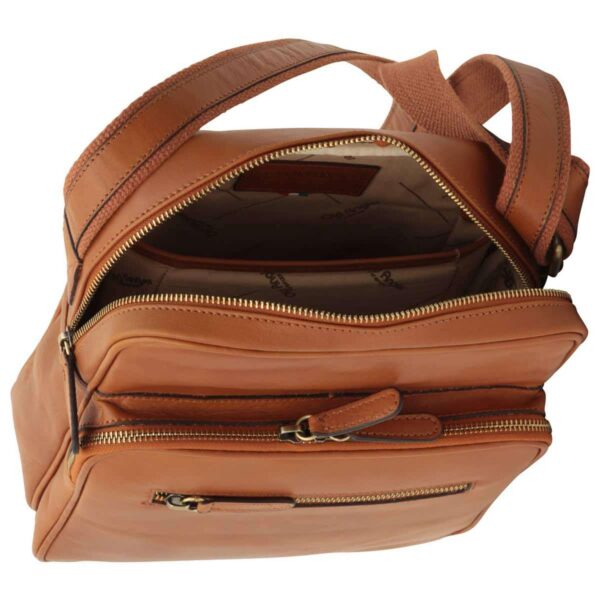 An overhead view of the tan leather messenger bag with the main compartment unzipped, revealing a patterned fabric lining and an internal leather brand patch. The image also highlights the secondary zippered pockets and the top of the adjustable shoulder strap.