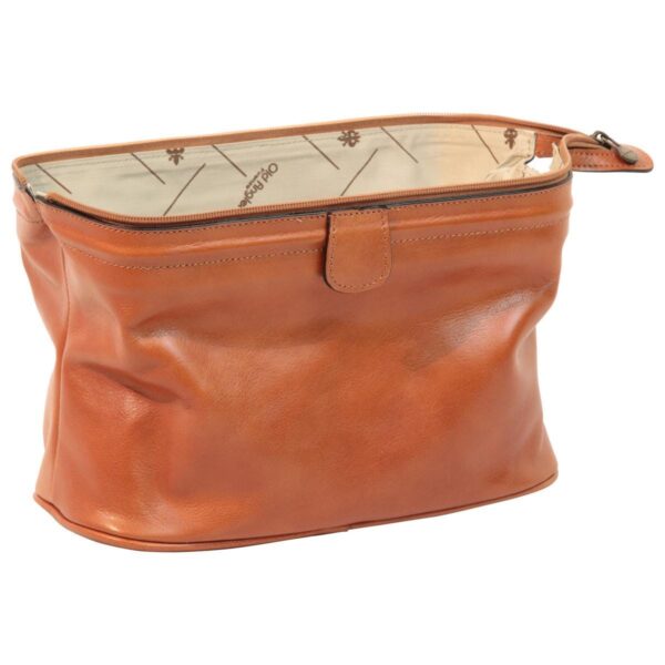 Side-angled view of an open tan leather toiletry bag, showing the branded beige fabric lining, a top zipper closure, and a structured base.