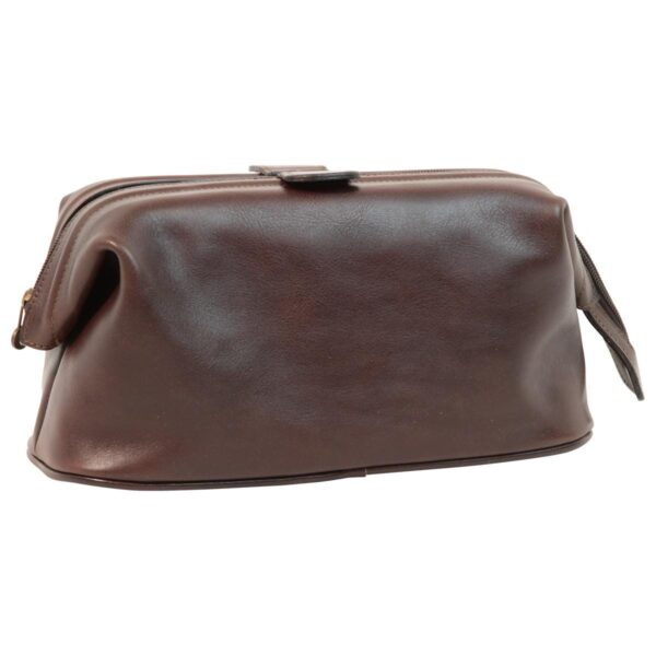 Front view of a closed dark brown leather toiletry bag, featuring a central zipper with leather pull tabs and a structured rectangular design with a smooth, polished finish.