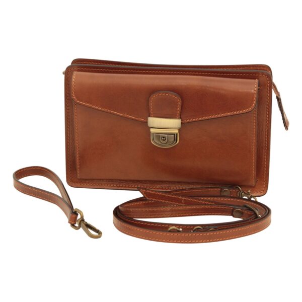 Front view of a tan leather clutch bag with a wrist strap, long shoulder strap, and brass tuck lock closure