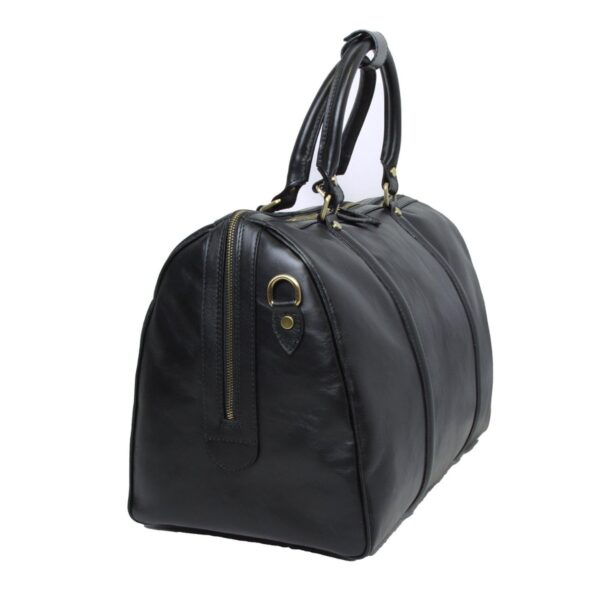 A three-quarter view of a black leather duffel bag, showing its structured side profile, a side zipper detail with a brass-tone D-ring, and rounded top carry handles.