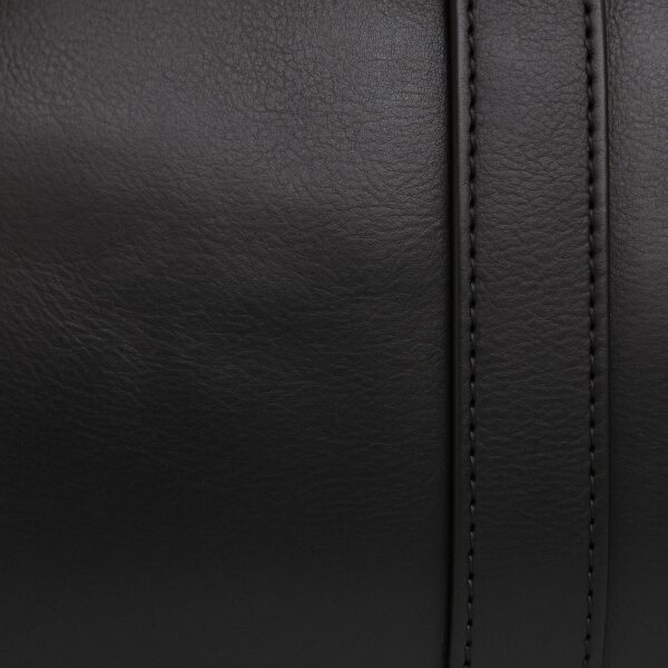 A macro close-up shot of the black full-grain leather surface of a bag, showing the fine natural texture and detailed vertical stitching on a reinforced leather strap.
