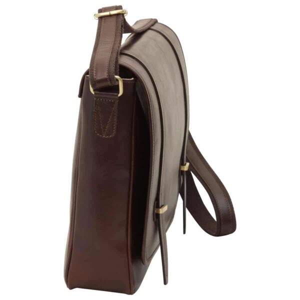 ### Image 1: `image_682a62.jpg` A low-angle view looking into the open dark brown leather messenger bag, showing the magnetic snap components on the underside of the flap and a slim zippered pocket at the top of the main compartment. ### Image 2: `image_687c25.jpg` A front view of the dark brown leather messenger bag with the top flap pulled back, revealing the two magnetic snap closures and a front slip pocket for quick-access items. ### Image 3: `image_687cfb.jpg` A side profile of the dark brown leather messenger bag, showcasing its slim design, sturdy side stitching, and the brass hardware connecting the adjustable leather shoulder strap.