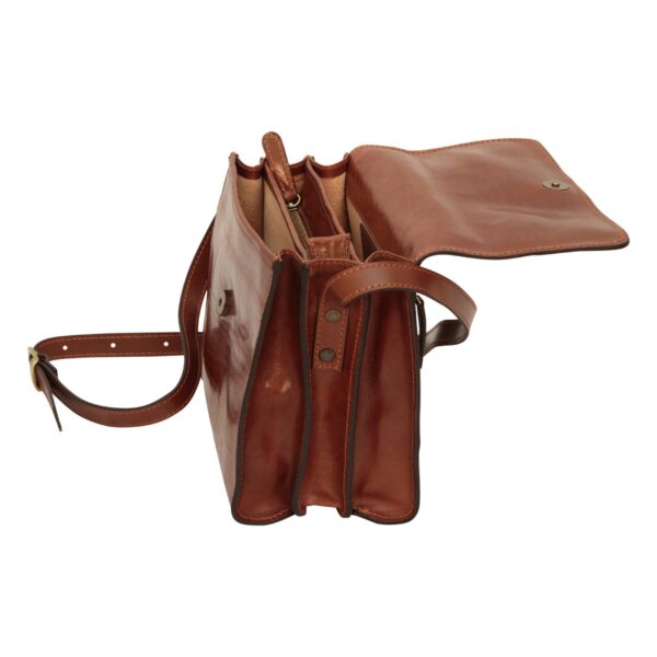 A side-profile view of an open brown leather messenger bag, emphasizing its three-compartment accordion structure. The bag features a wide top flap with a magnetic snap, a central zippered divider, and an adjustable leather shoulder strap attached with bronze-toned rivets.