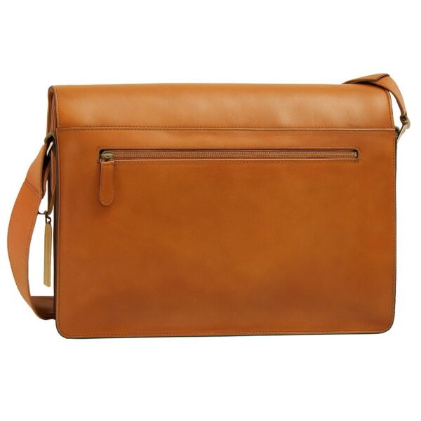 A lifestyle shot of a young man in a light blue shirt walking outdoors, carrying a tan leather messenger bag by his side. The bag features a structured horizontal design with a front flap and a wide orange canvas shoulder strap.