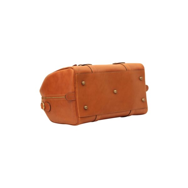 The bottom view of a tan leather weekender bag on a white background, highlighting five protective brass metal feet (studs) and reinforced leather stitching.