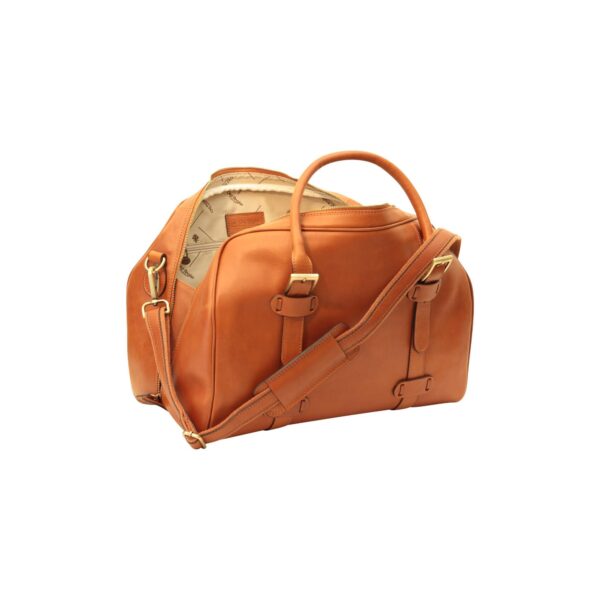 An open, tan leather weekender bag shown from a side perspective on a white background, featuring a cream patterned interior lining, gold-tone buckles, and a matching adjustable shoulder strap.