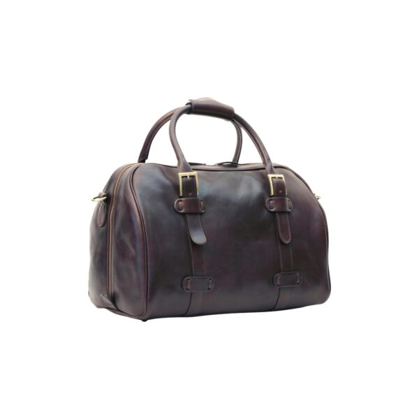 A dark brown leather weekender bag shown at a three-quarter angle against a white background, featuring two top handles with a leather connector, gold-tone buckles on the front straps, and a side zipper.