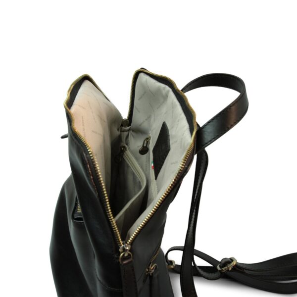Black leather backpack with zipper, open interior showing organized compartments and lining