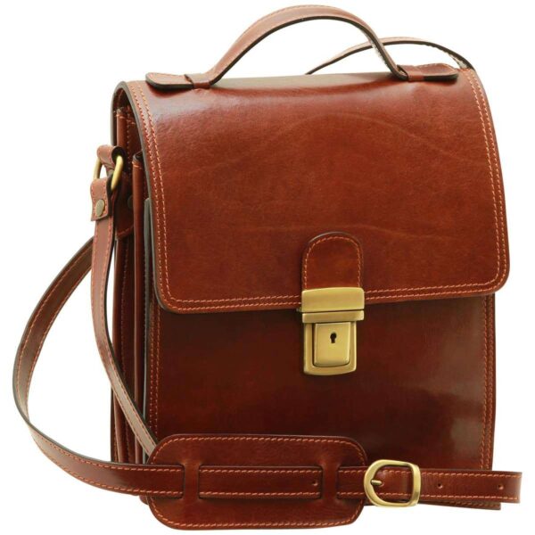 `Dark tan genuine leather flap messenger bag with antique gold push-lock clasp closure, top carry handle and adjustable shoulder strap with pad, front angle view`