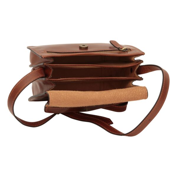 An open, brown leather crossbody bag shown from a top-down perspective to reveal three separate interior compartments. The bag features a matching leather shoulder strap, a front zippered pocket, and a magnetic snap closure on the underside of the suede-lined flap.