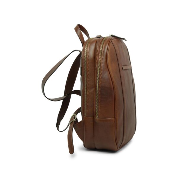 Interior view of an open tan brown leather backpack showing multiple zippered compartments with patterned cream lining Side view of tan brown leather backpack with multiple zippered compartments and adjustable shoulder straps