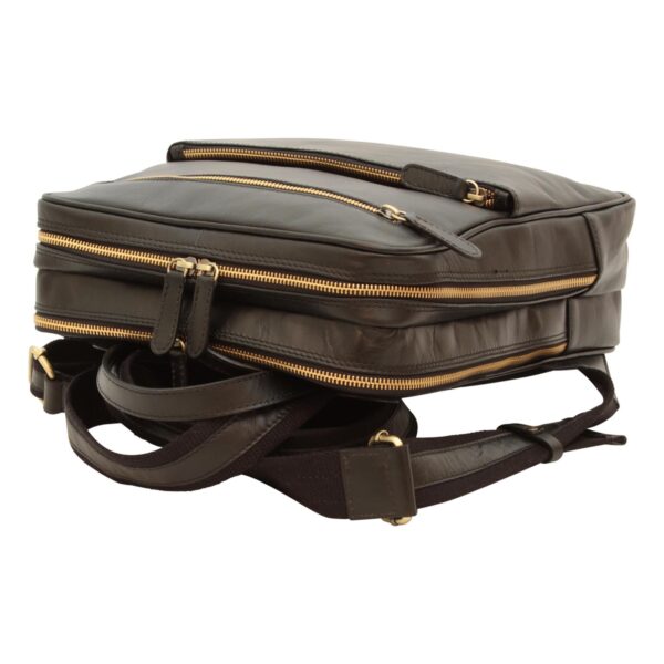 `Dark brown genuine leather laptop backpack lying flat showing multiple antique gold zipper compartments, top zip pocket and adjustable shoulder straps, top-down angle view`