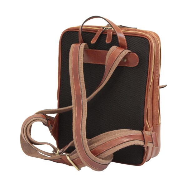 `Tan genuine leather and black mesh laptop backpack back view showing padded canvas shoulder straps, leather trim, top carry handle and antique gold side zipper`