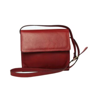 A red textured leather crossbody bag with a rectangular silhouette, featuring a front flap closure and a slim adjustable shoulder strap against a white background.