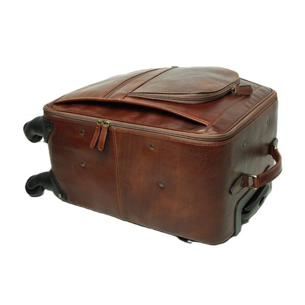 A high-angle view of a **brown leather carry-on suitcase** lying on its side against a white background. This perspective showcases the bag's depth, the reinforced leather side handle, and the various zippered compartments on the front and top for organized storage.