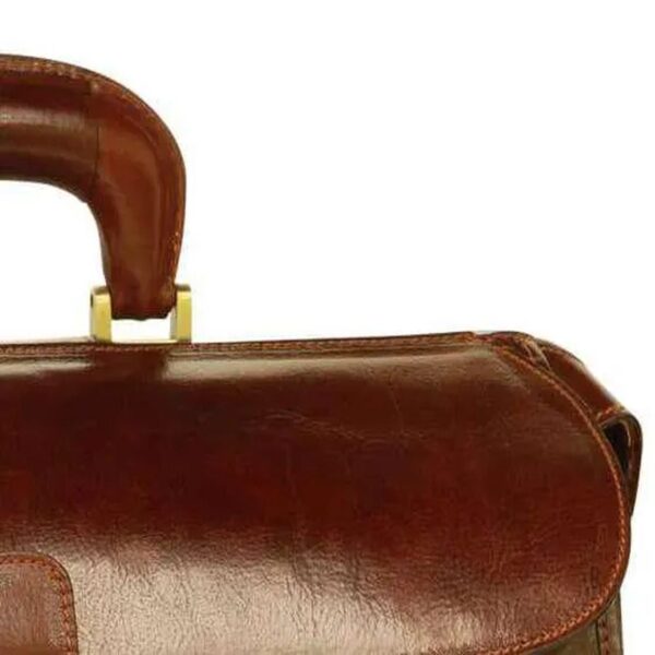Close-up of a brown leather briefcase with a curved top handle and gold hardware, showing detailed texture and stitching.