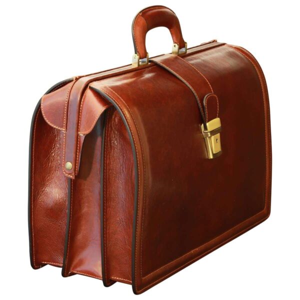 A three-quarter side view of a cognac-colored leather doctor-style briefcase, highlighting its expandable multi-compartment design, brass-tone hardware, and reinforced top handle.