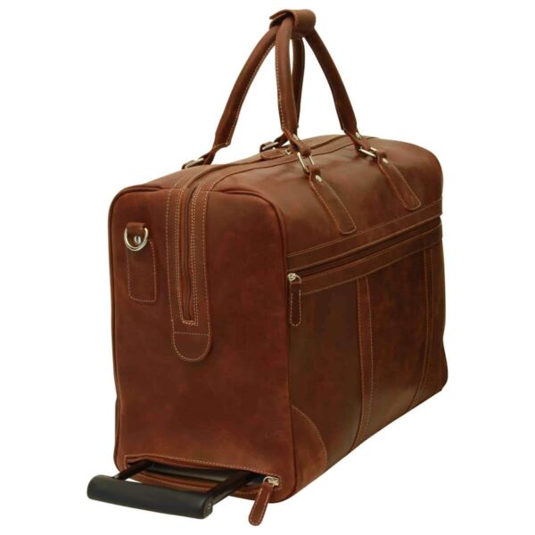 A three-quarter view of a brown leather rolling duffel bag, featuring reinforced top handles, a side-access zippered compartment for the telescopic handle, and a large front zippered pocket.