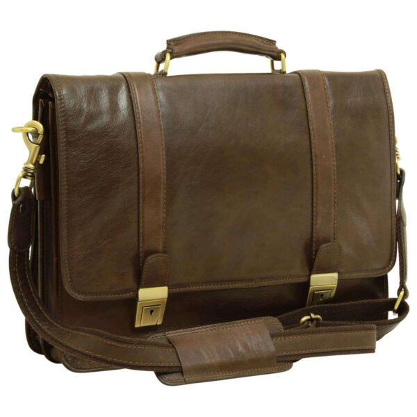 A front-angled view of a dark brown leather briefcase featuring a polished, slightly textured finish. This model includes a matching adjustable shoulder strap with a sliding leather pad for comfort, attached via brass-toned swivel clips. The design is completed with a reinforced top handle, vertical strap accents, and two brushed metal tuck-lock fasteners with integrated keyholes.