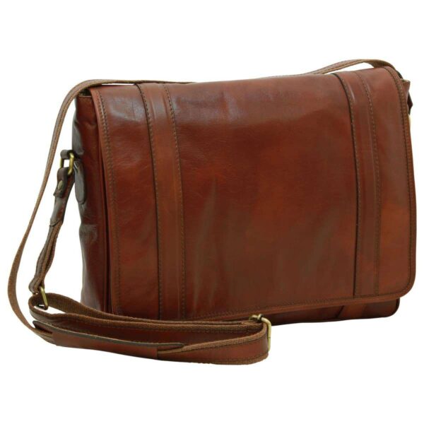 A three-quarter front view of a tan leather messenger bag featuring a large front flap with two vertical stitched leather accents and an adjustable shoulder strap with a padded section, set against a white background.