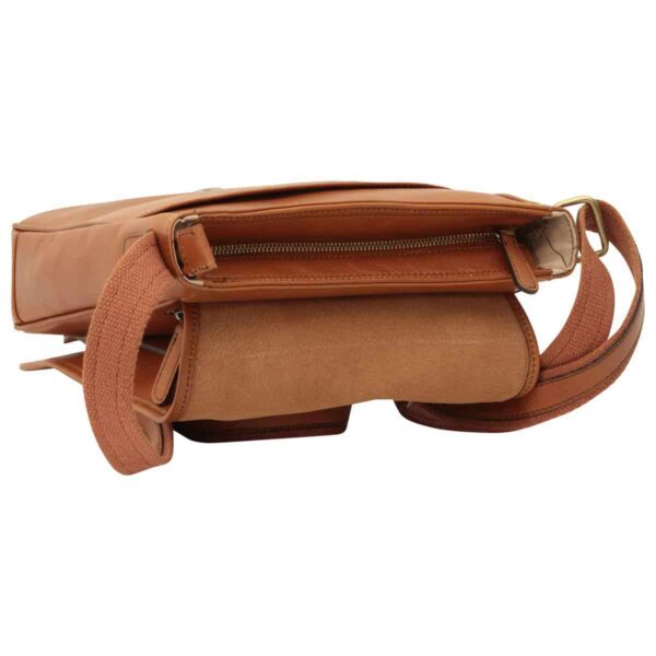 An open view of the tan leather messenger bag from above, showing a zippered main compartment, a suede-lined flap interior, and a matching canvas shoulder strap.