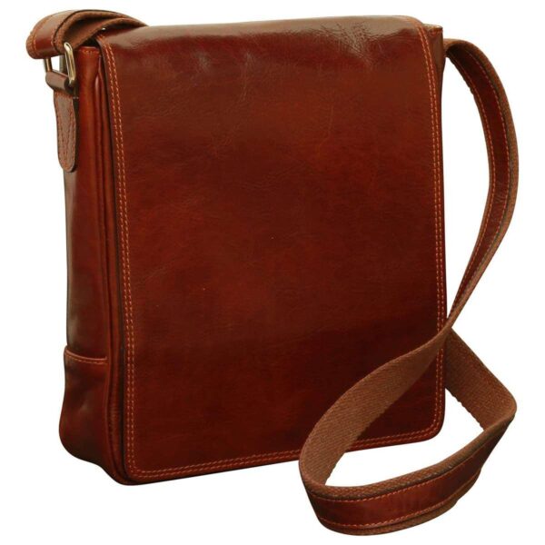 A front-angled view of a vertical brown leather messenger bag featuring a smooth full-cover flap, a canvas shoulder strap, and polished edge stitching.