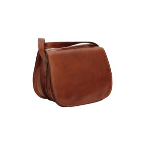 A three-quarter view of a smooth, cognac-colored leather saddle bag with a rounded front flap and visible accordion-style side panels, featuring a matching leather shoulder strap.