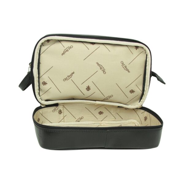 An open view of the zippered bottom compartment of the black leather toiletry bag, revealing a cream-colored fabric lining printed with the "Old Angler Firenze" logo and fleur-de-lis motifs.