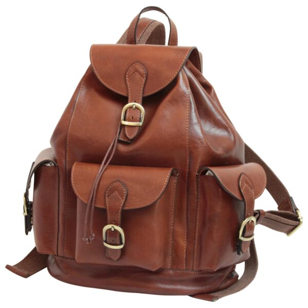 A front view of a cognac-brown leather backpack featuring a large top flap and three external pockets, all secured with brass-toned buckles and leather straps, showcasing a classic vintage design.