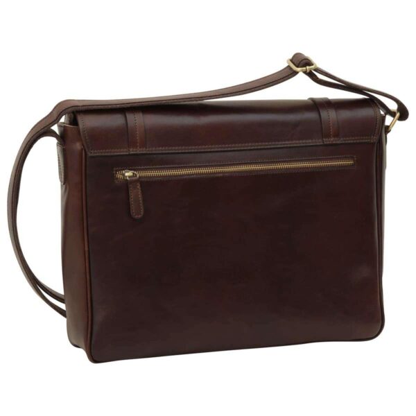 A close-up view of the back of the dark brown leather messenger bag, highlighting the reinforced leather top handle secured with brass rivets and the adjustable shoulder strap attached via a brass D-ring.
