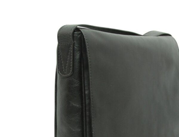 A close-up side view of a black leather messenger bag, highlighting the top corner where the shoulder strap is stitched to the main body with a reinforced triangular pattern.