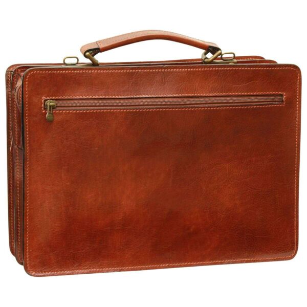 A rear view of a cognac-colored leather briefcase, featuring a horizontal zippered pocket, a reinforced top handle with brass-tone hardware, and clean, tonal stitching along the edges.