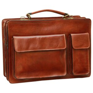 A front-facing view of a cognac-colored leather briefcase, highlighting its two external front pockets with flap closures—one large and one slim—along with a sturdy top handle and antique-style brass hardware.