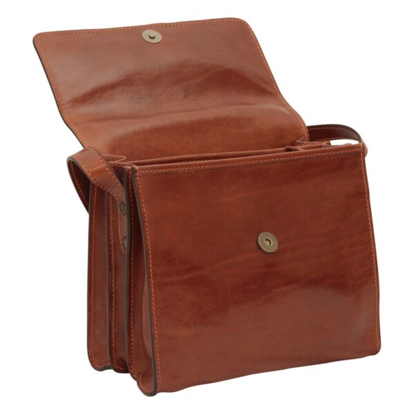 A front-angle view of an open brown leather messenger bag, highlighting its accordion-style three-compartment structure. The image shows a large open flap with a magnetic snap button and a matching bronze-toned fastener on the front pocket.